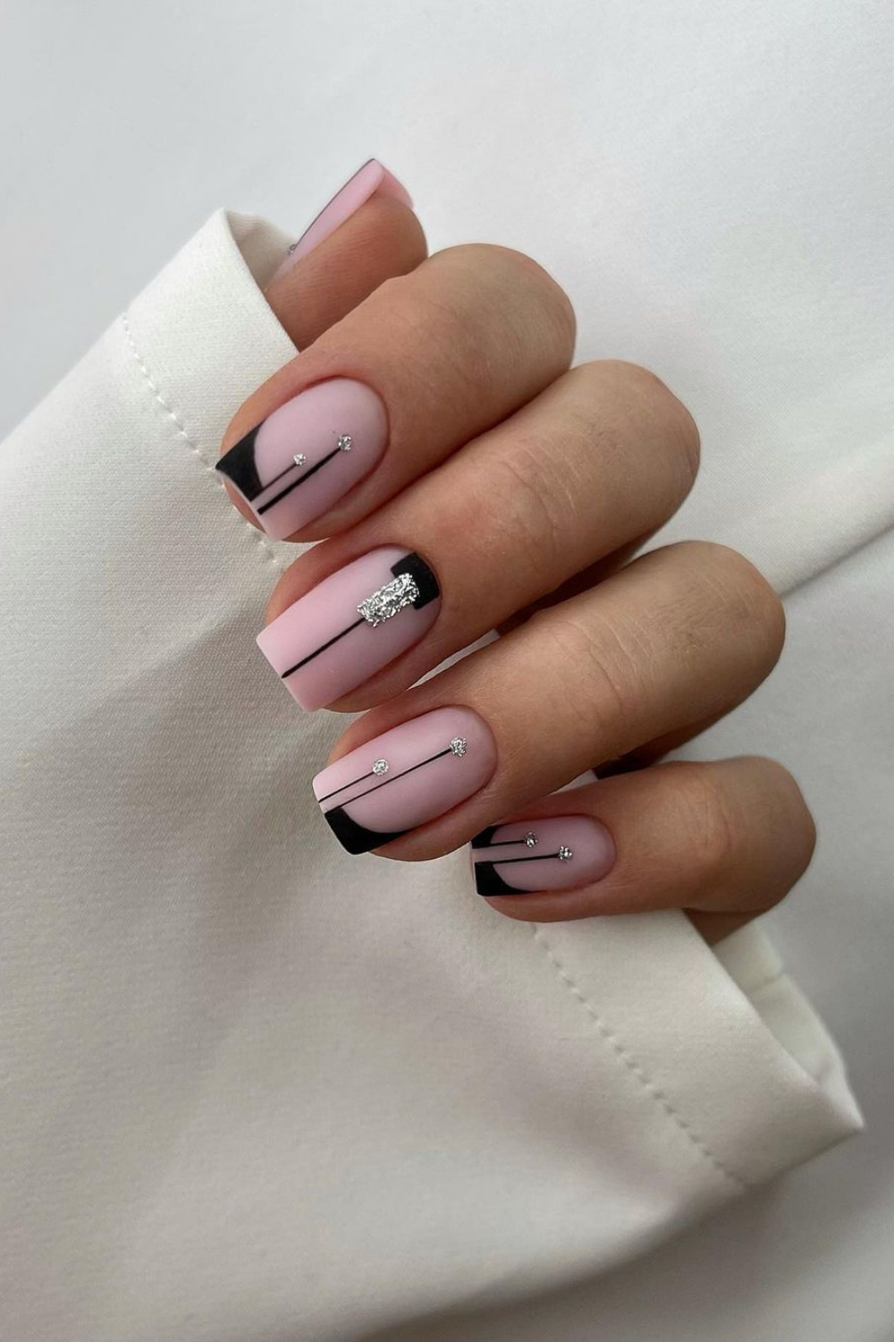 Premium Photo | Light pink nail design with white lines, rhinestones,  glitter with gladiolus.